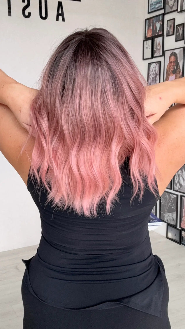 middle part, wavy pink hair with dark root, heat safe glueless wig.