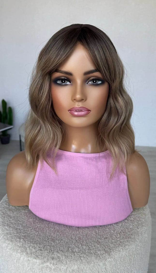 fringe parted to the side, middle part, wavy fringe bob wig.