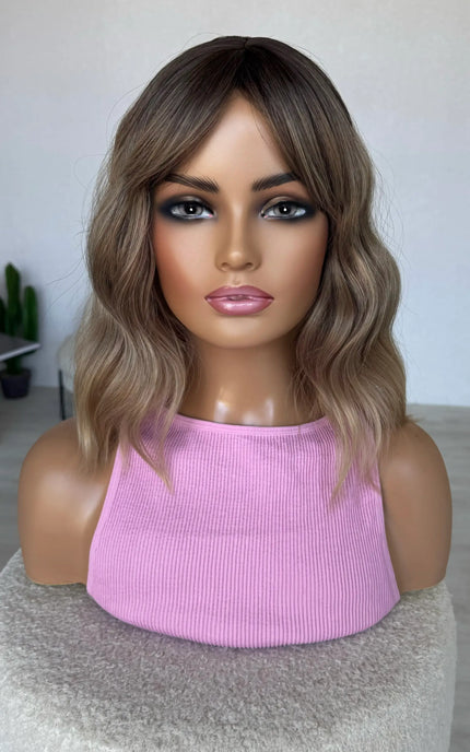fringe parted to the side, middle part, wavy fringe bob wig.