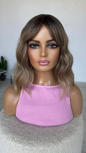 fringe parted to the side, middle part, wavy fringe bob wig.