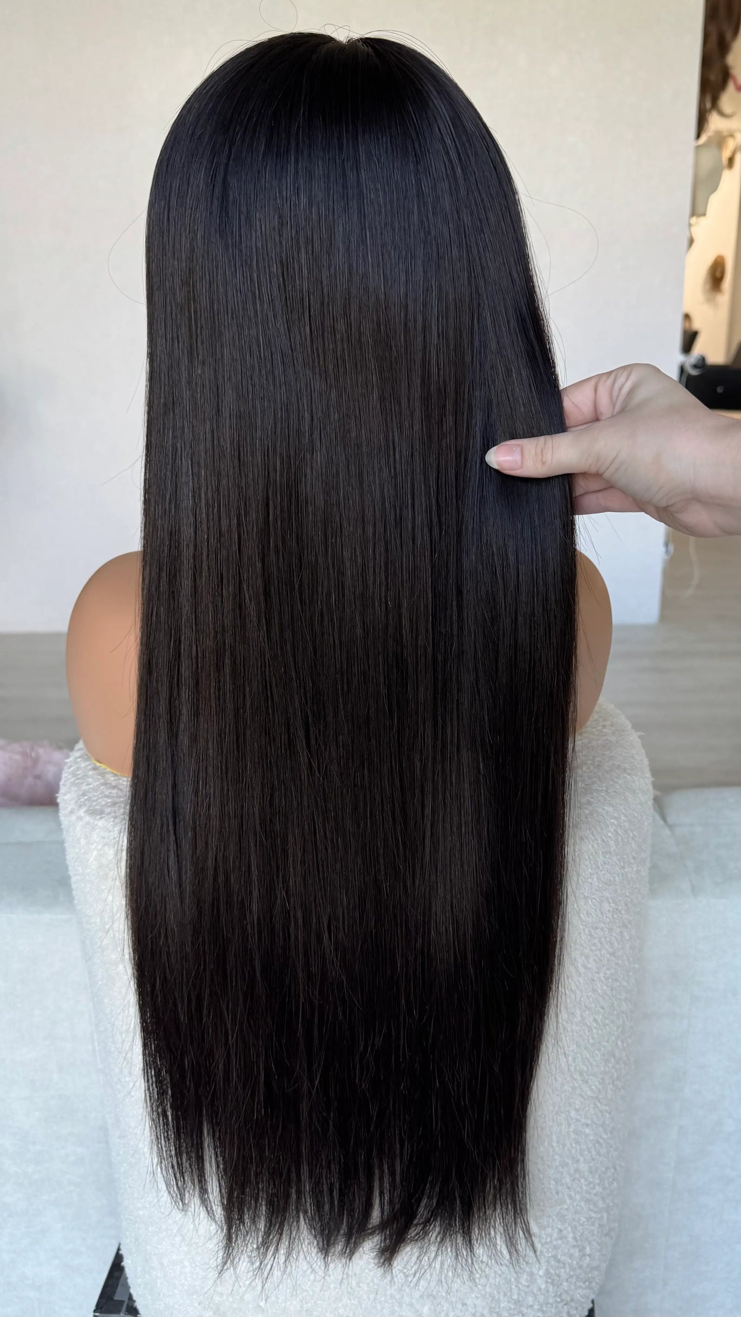 medical black hair wig from back, holdnig 26 inch hair, straight hair, middle part. medical lace front wig australia.