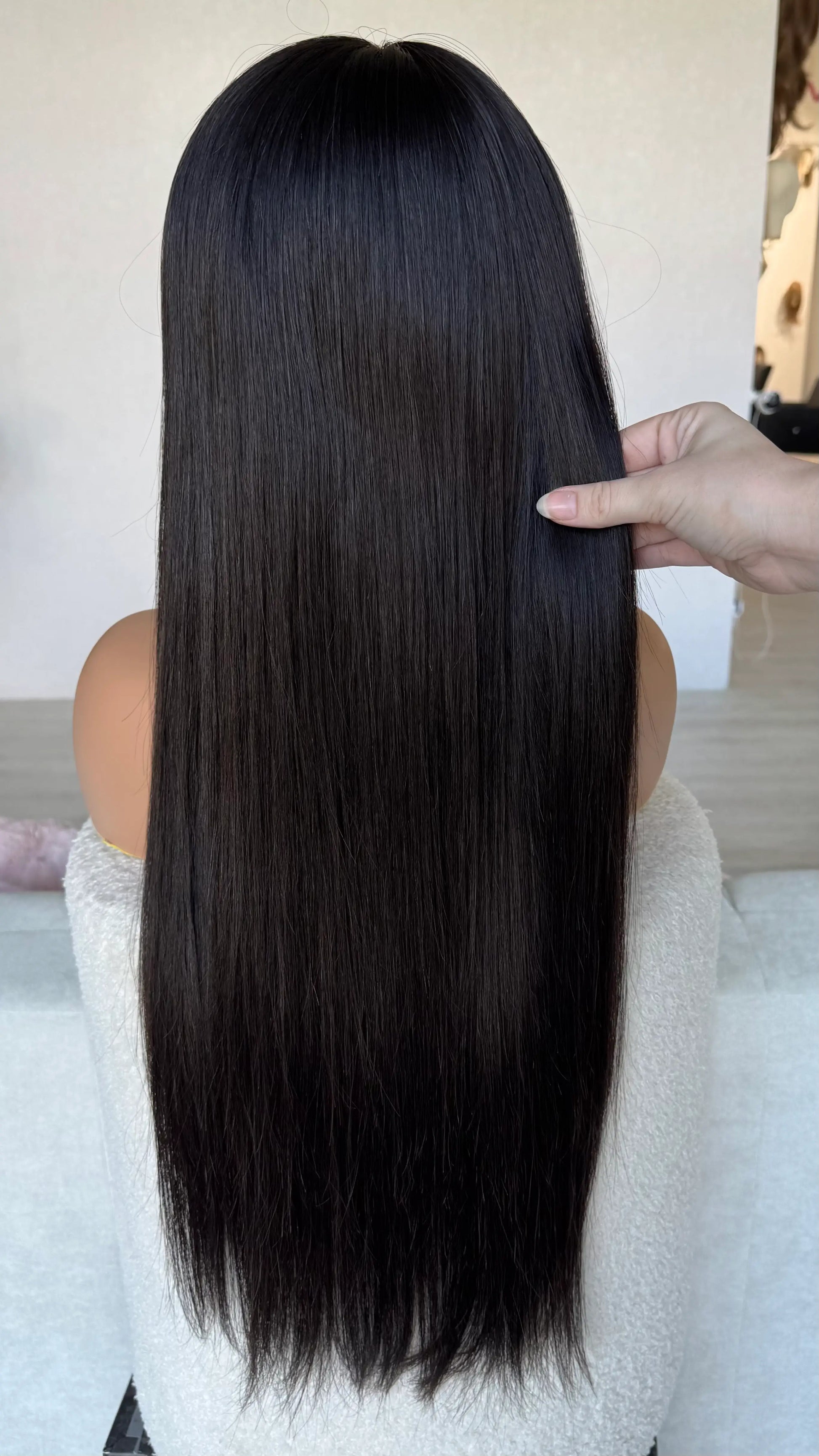 medical black hair wig from back, holdnig 26 inch hair, straight hair, middle part. medical lace front wig australia.