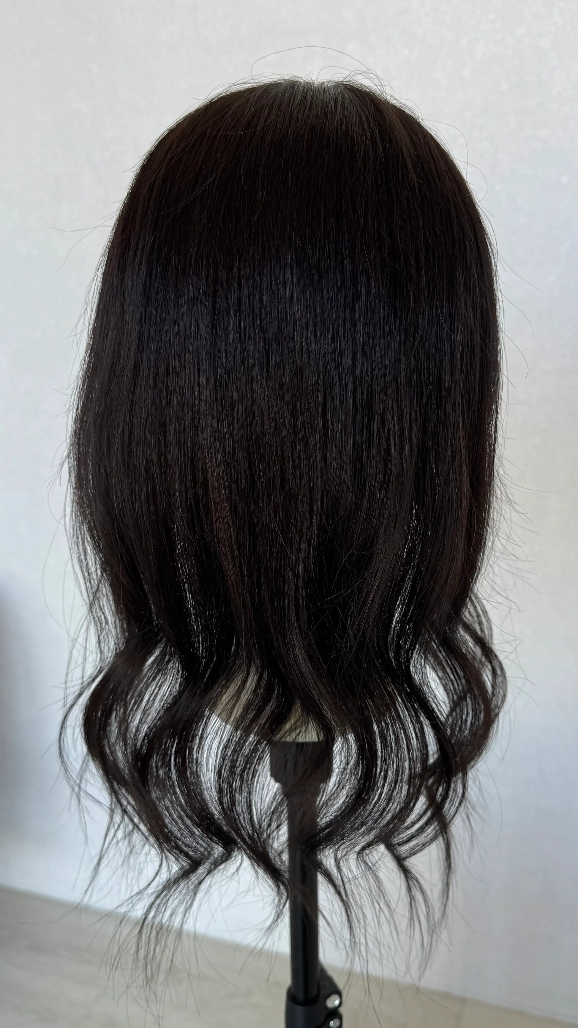 20 inch black human hair topper from behind 