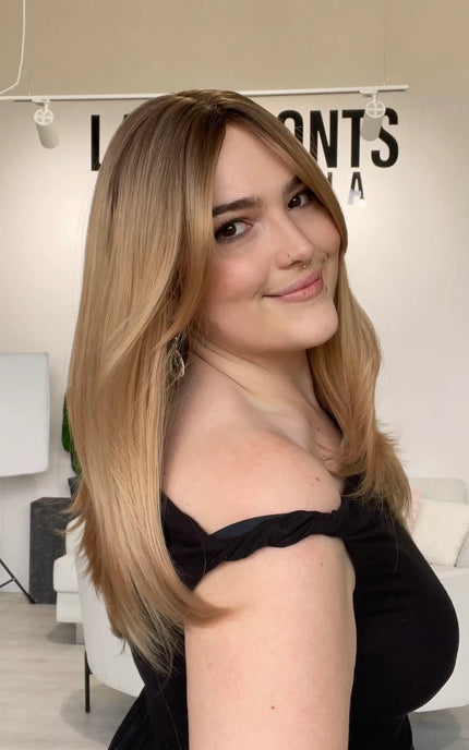 a glueless wig for hairloss, blonde ombre colouring with layers and curtain bang styling