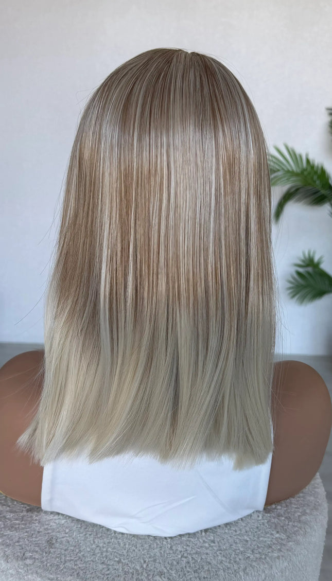 straight hair topper from behind blonde hair