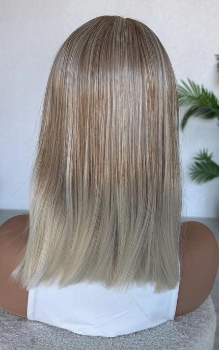 straight hair topper from behind blonde hair