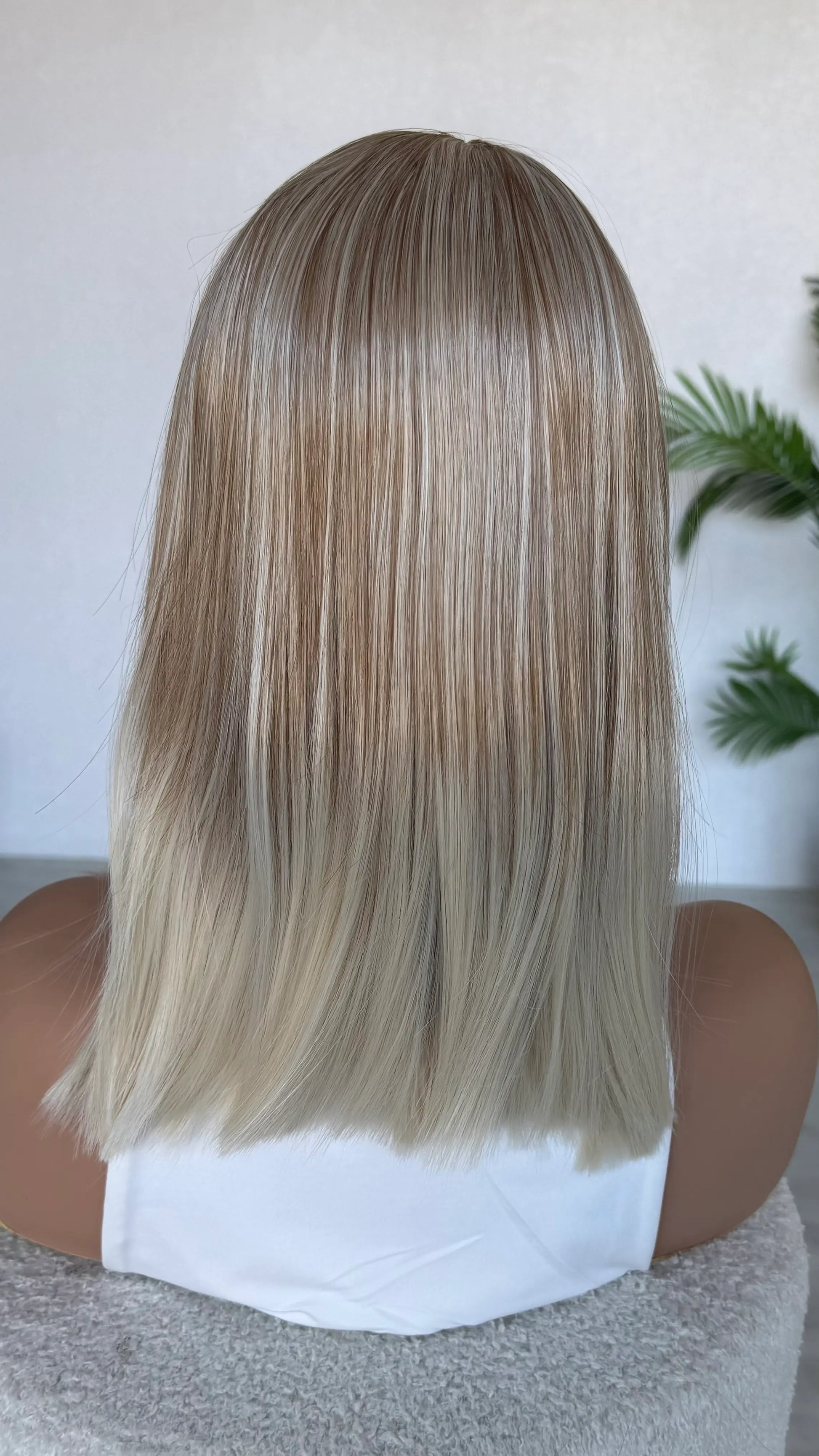 straight hair topper from behind blonde hair