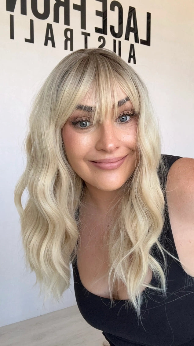 middle part, wavy blonde hair synthetic topper, heat safe and gluless.