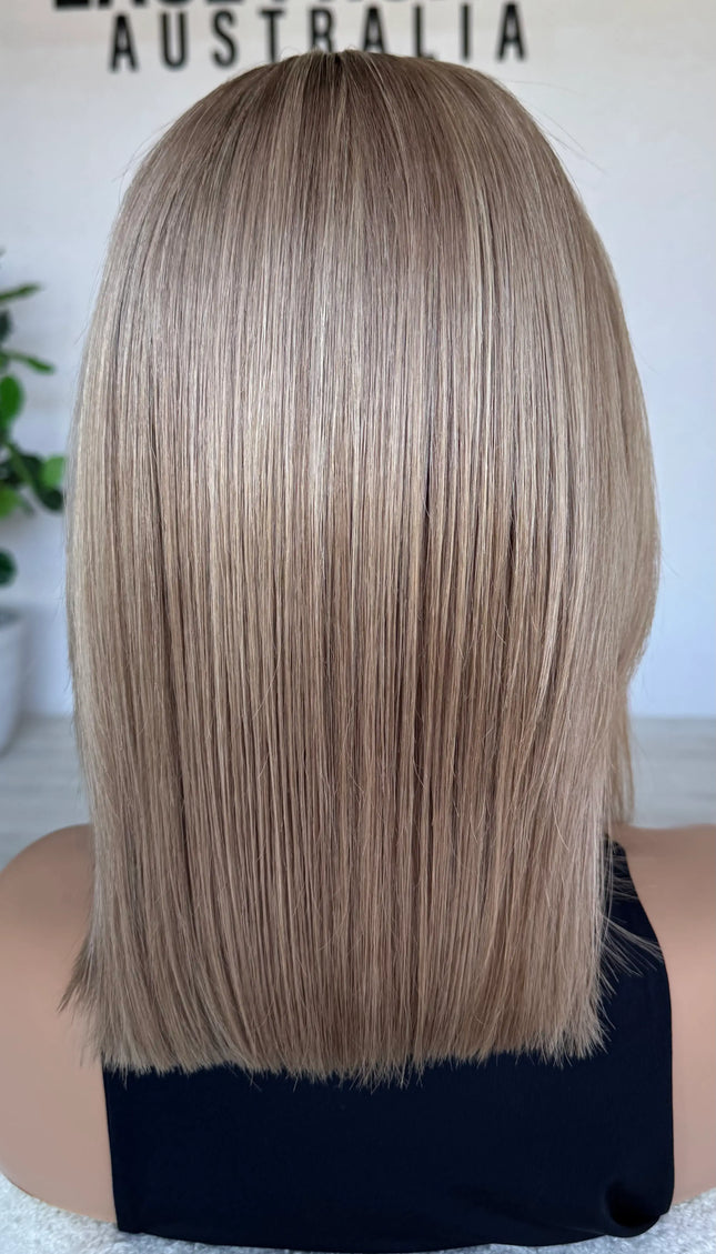 blonde wig from the back , natural hair. soft blend of blonde colour.