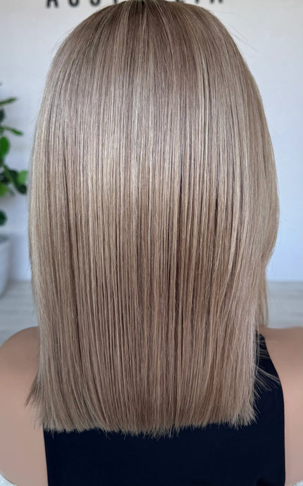 blonde wig from the back , natural hair. soft blend of blonde colour.