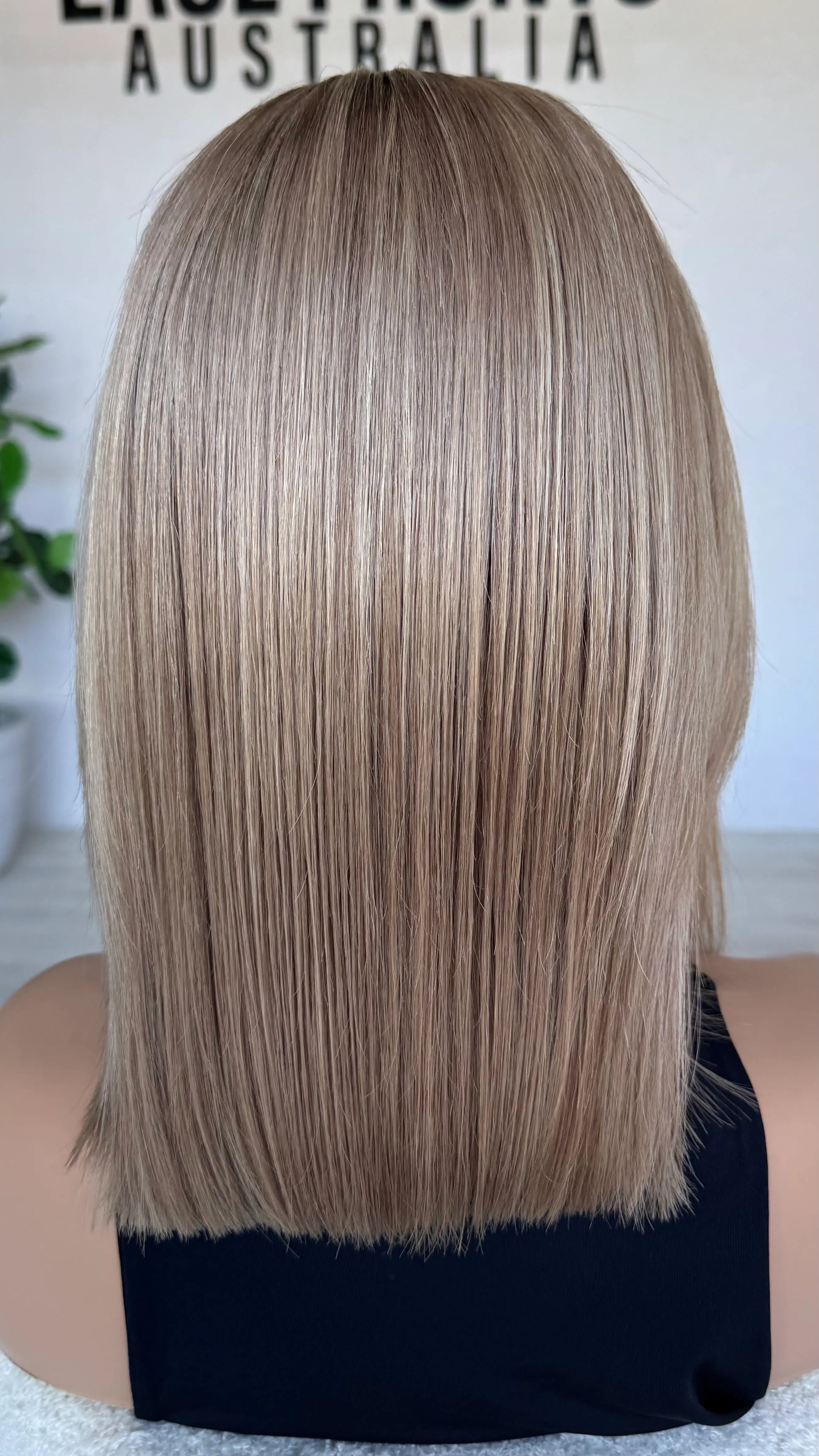 blonde wig from the back , natural hair. soft blend of blonde colour.