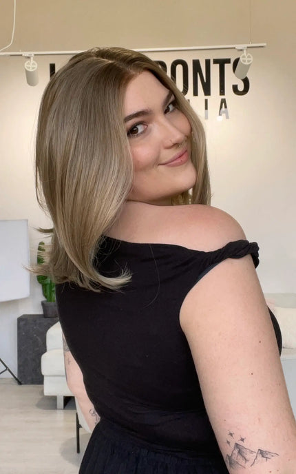 bob length dark blonde natural looking synthetic wig with a glueless cap for easy everyday wear.