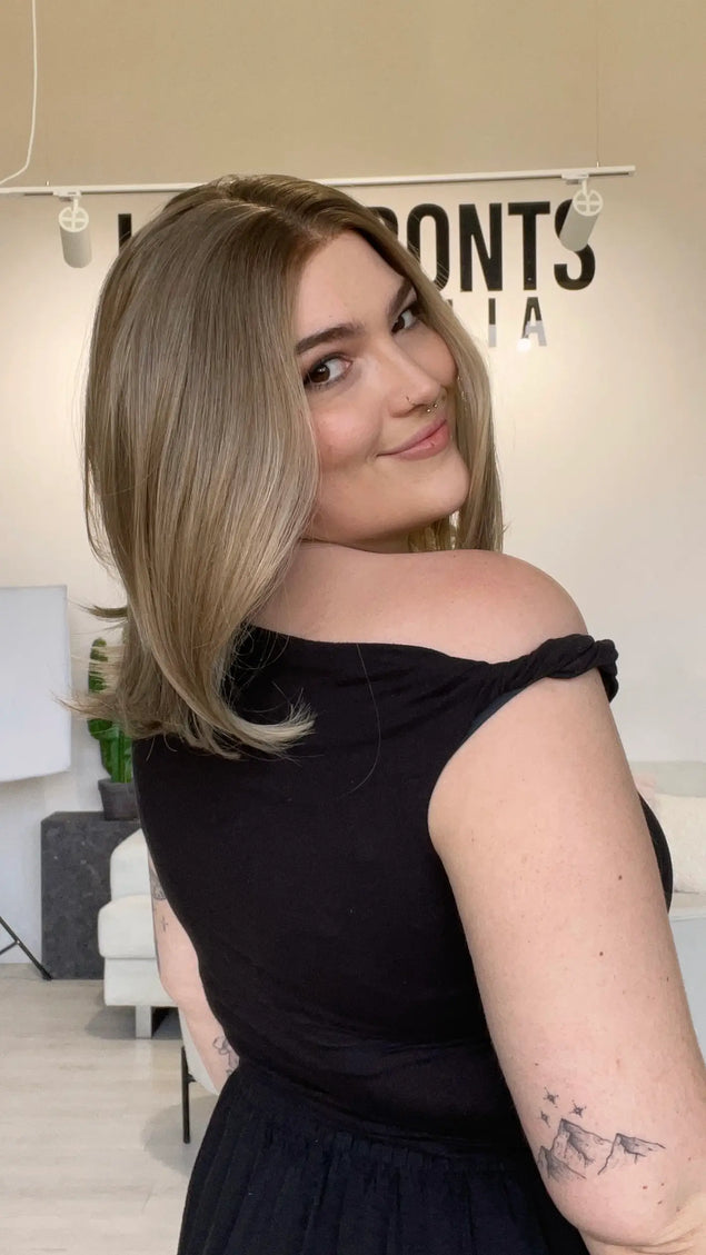 bob length dark blonde natural looking synthetic wig with a glueless cap for easy everyday wear.