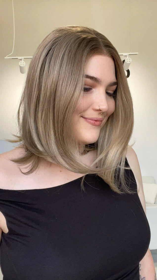 A lace front glueless heat safe blonde synthetic 12 inch bob wig.