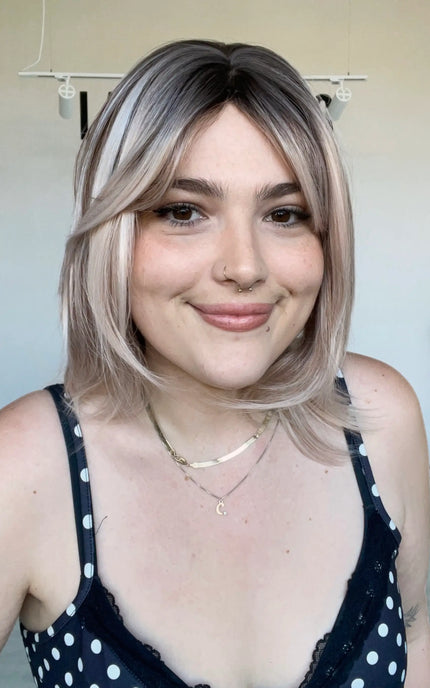 realistic synthetic wig with heat safe hair, bob length.