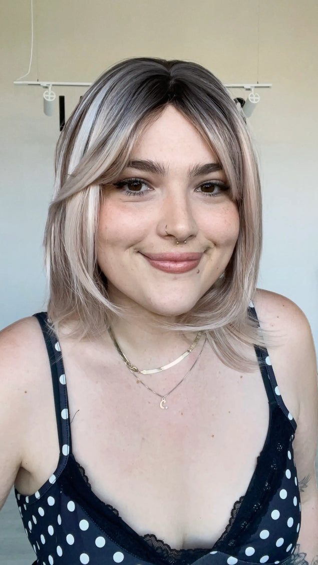 realistic synthetic wig with heat safe hair, bob length.