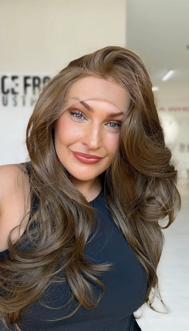 soft bouncy brunette lace front wig with layers throughout.