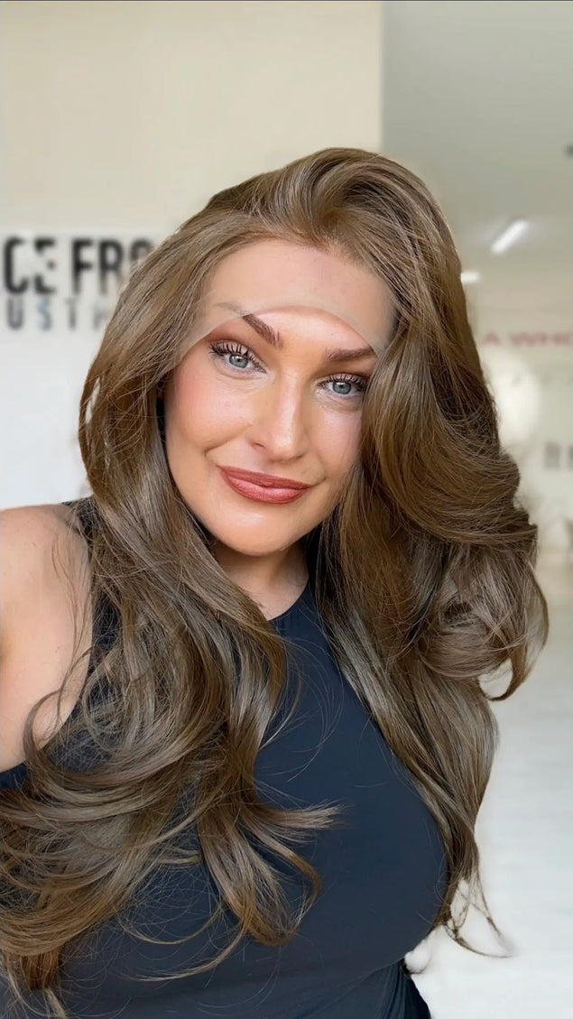 soft bouncy brunette lace front wig with layers throughout.