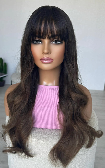 long brunette hair with soft waves. middle part synthetic hair.