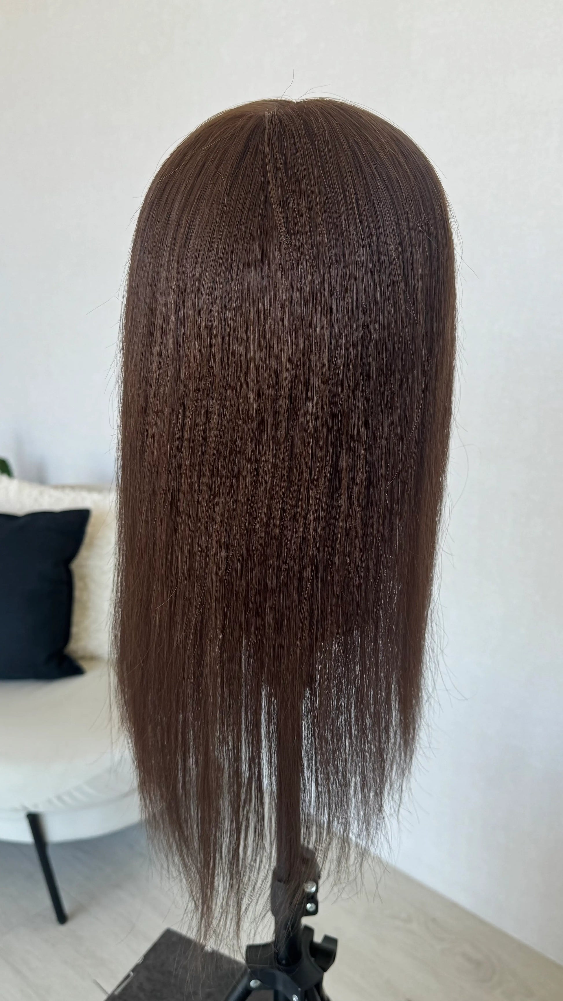 brunette wig on stand shwoing hair length