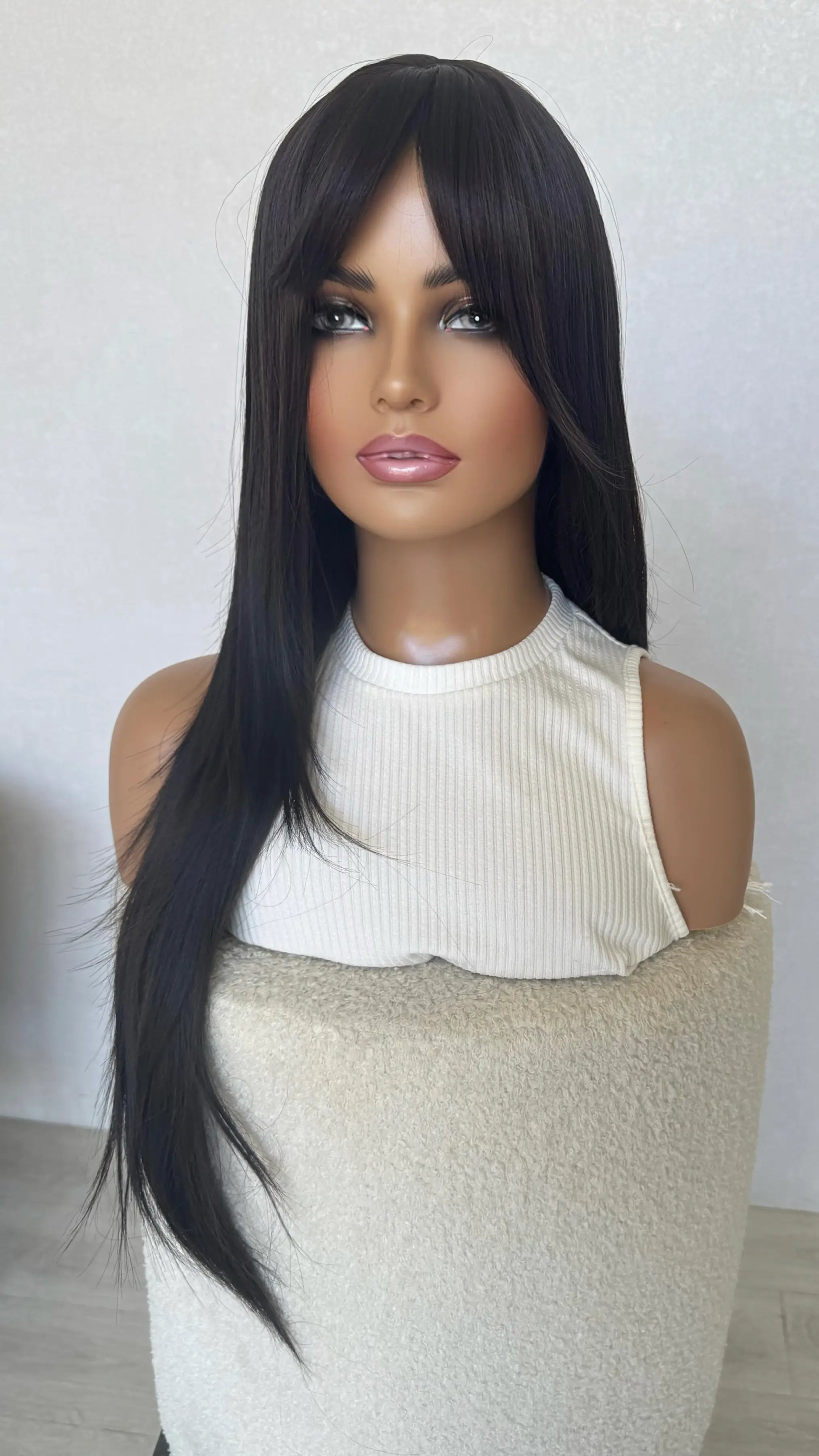 dark brunette synthetic , heat safe, glueless wig.