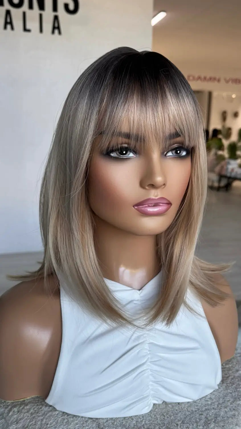 dark root to mixed blonde bob, middle part with fringe