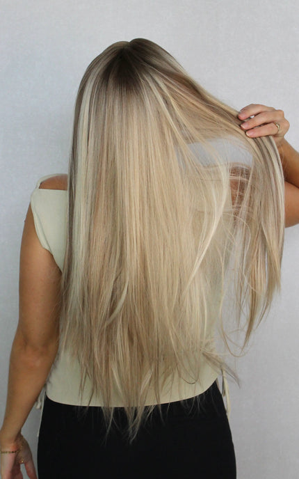 synthetic wig from the back. long blonde wig. lacefront