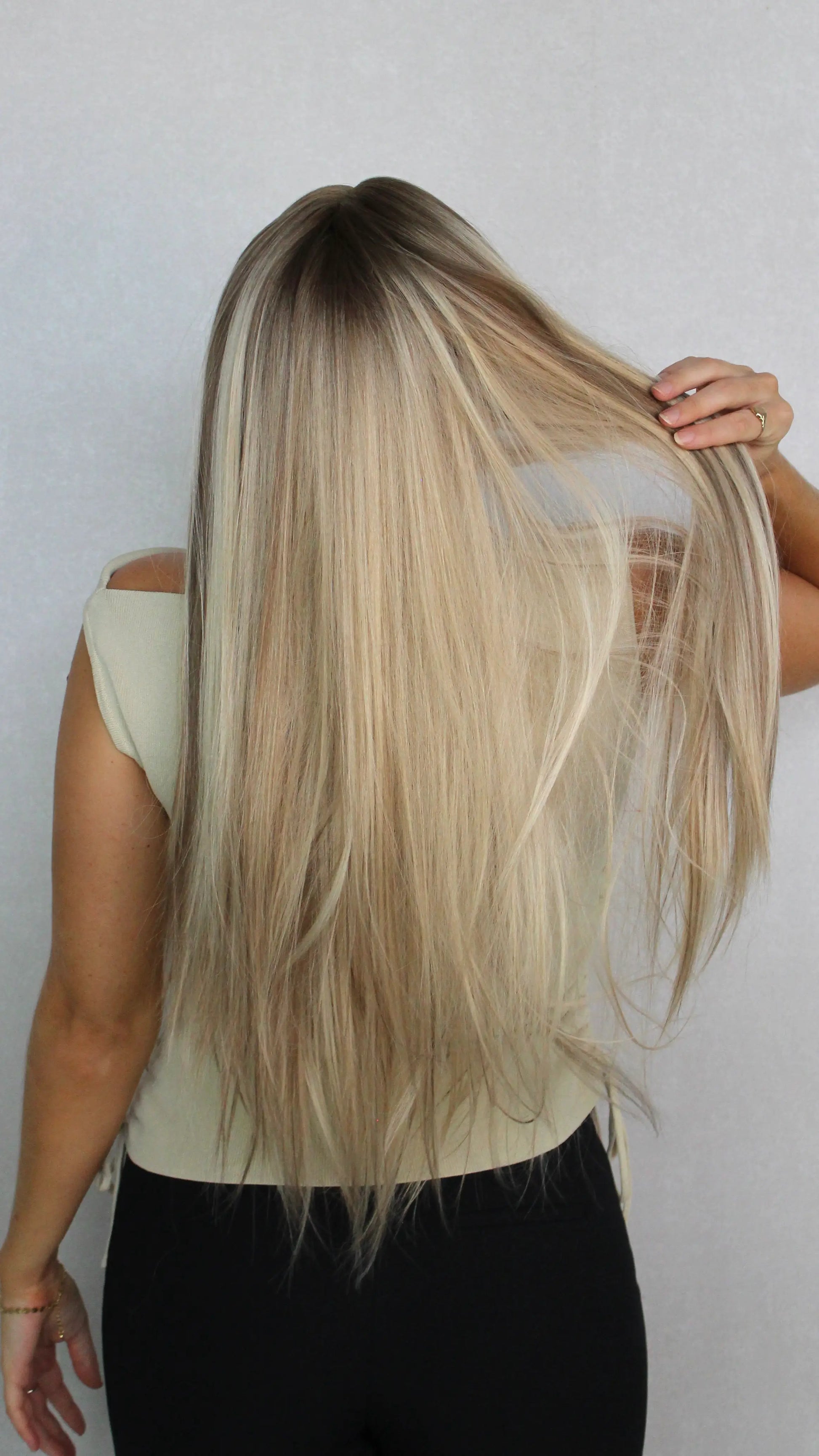 synthetic wig from the back. long blonde wig. lacefront