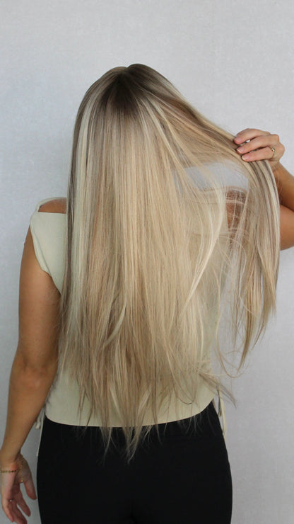 synthetic wig from the back. long blonde wig. lacefront
