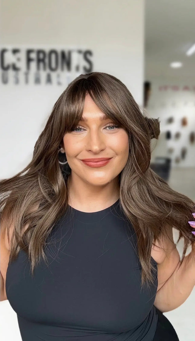 cool toned ash brunette hair with long curtain bangs and middle part, ash brown coloured hair.