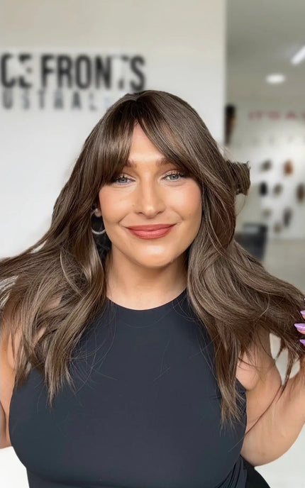 cool toned ash brunette hair with long curtain bangs and middle part, ash brown coloured hair.