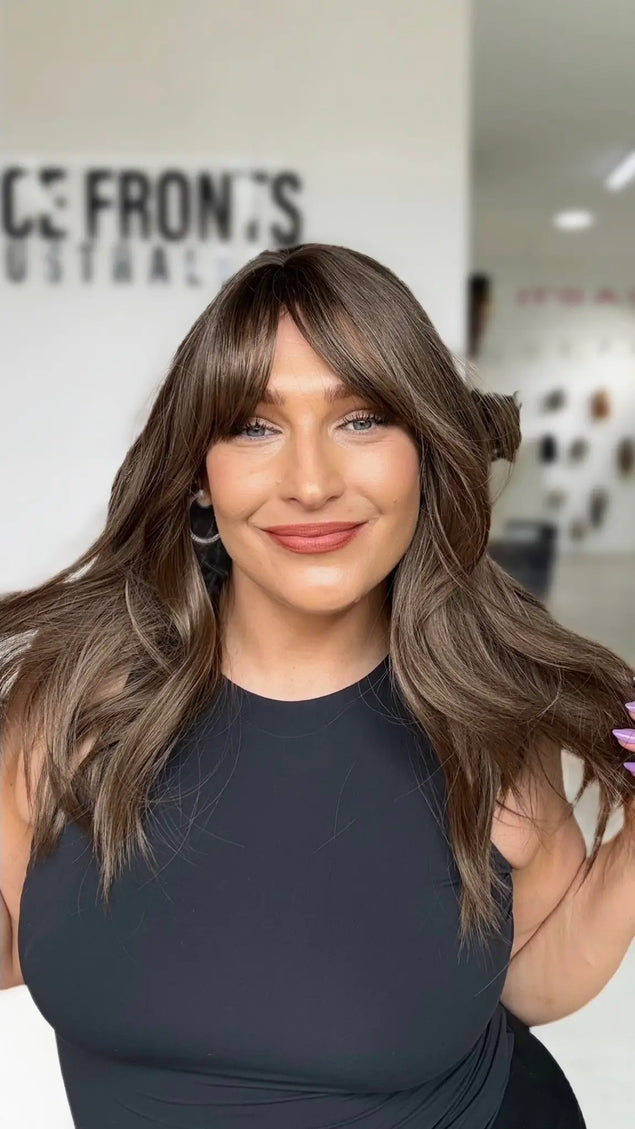 cool toned ash brunette hair with long curtain bangs and middle part, ash brown coloured hair.