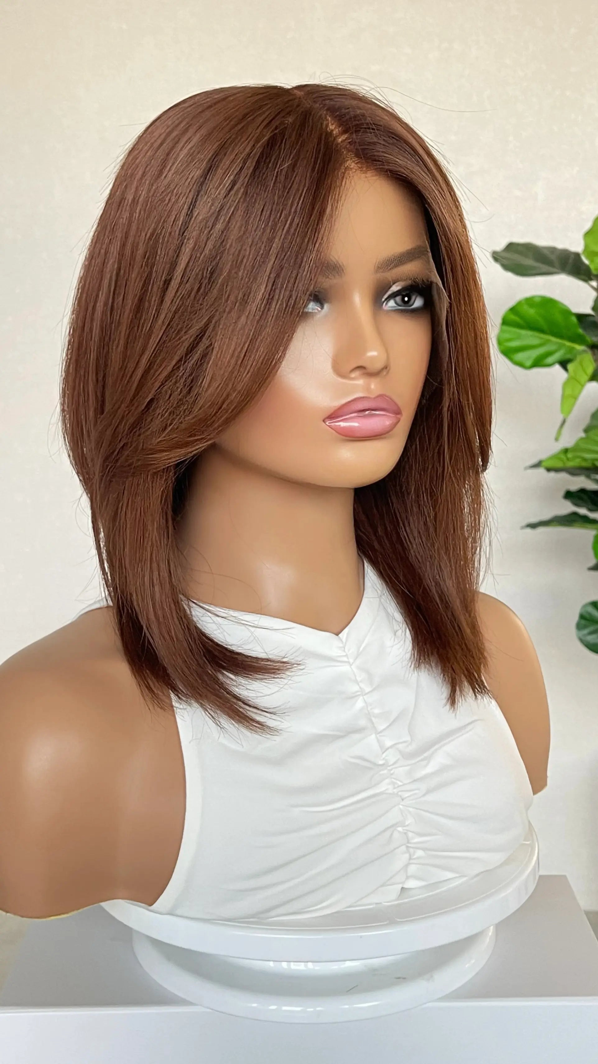 Another side profile of the wig, highlighting its smooth texture and natural transition from the shadow root to vibrant copper brunette