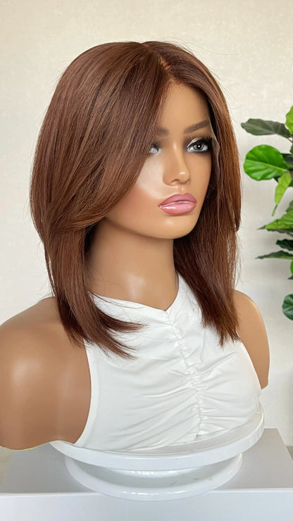 Another side profile of the wig, highlighting its smooth texture and natural transition from the shadow root to vibrant copper brunette