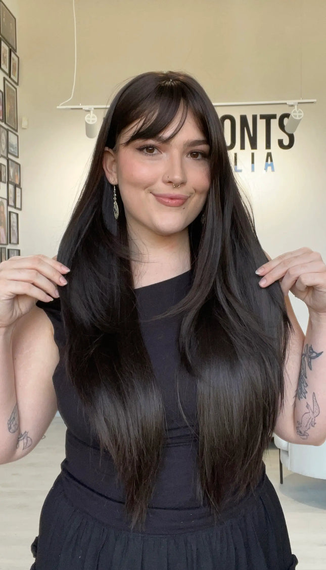 heat safe glueless wig with dark brown layered hair.