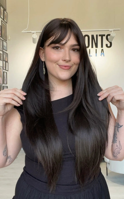 heat safe glueless wig with dark brown layered hair.