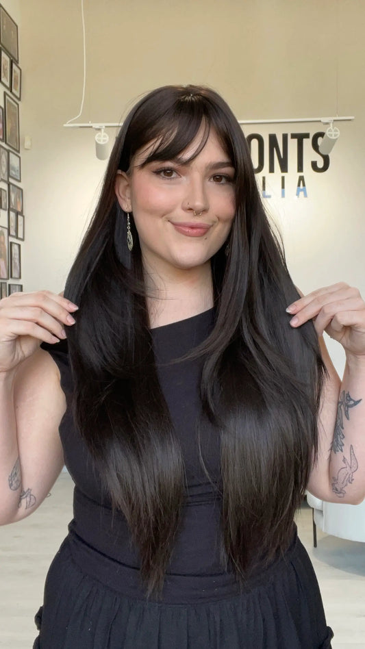 heat safe glueless wig with dark brown layered hair.