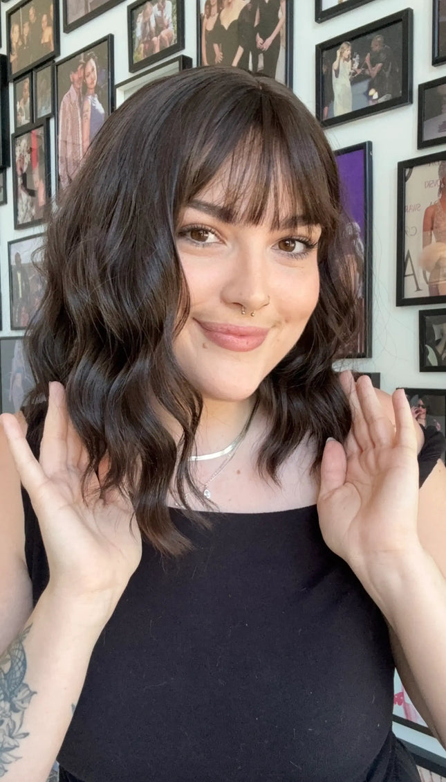 heat safe synthetic wig with dark brown wavy hair and fringe.