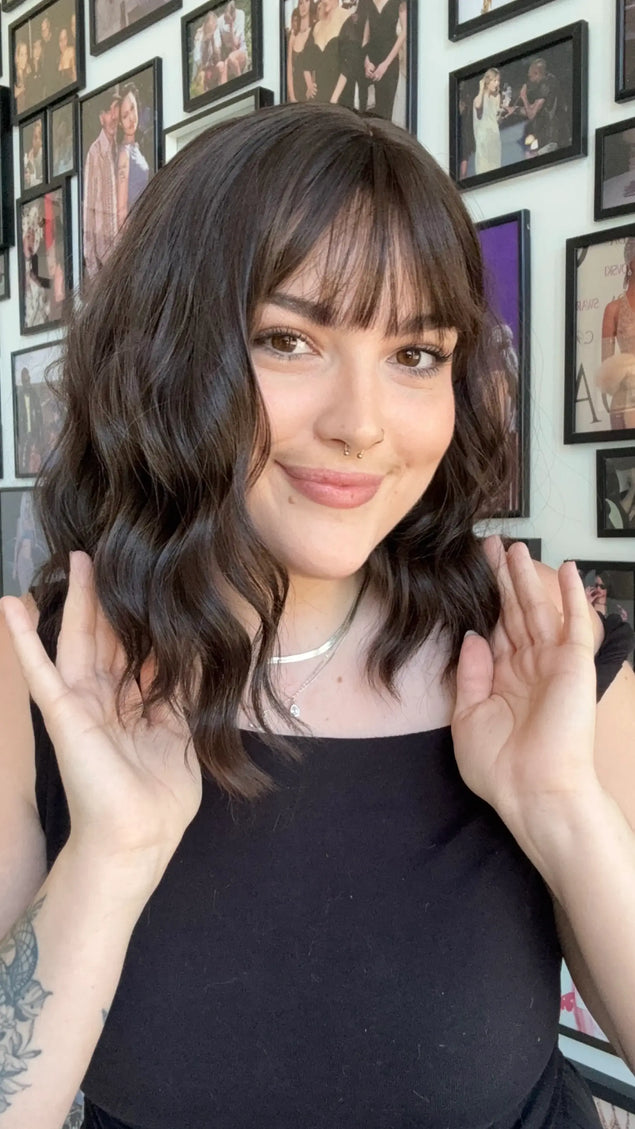 heat safe synthetic wig with dark brown wavy hair and fringe.