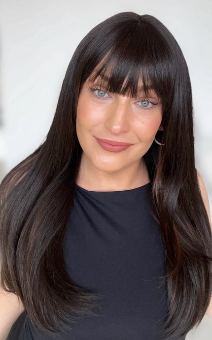 dark brunette straight long hair with middle part and soft fringe, chestnut highlights on the underside.