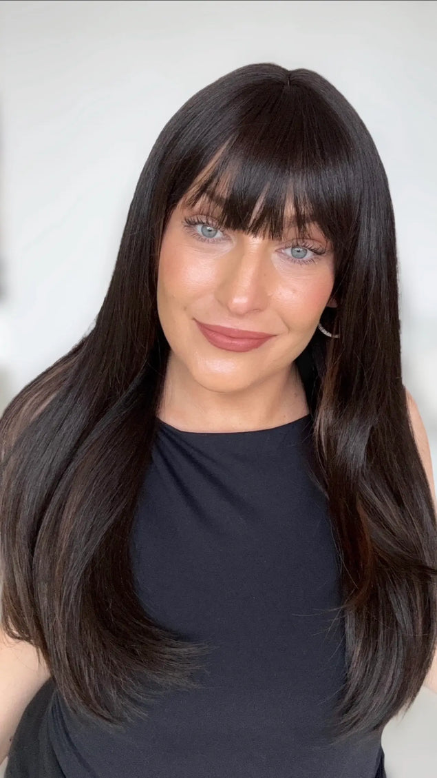 dark brunette straight long hair with middle part and soft fringe, chestnut highlights on the underside.