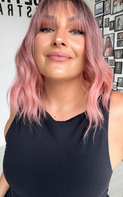 dark root to wavy pink hair wig, middle parting with 14 inch length. heat safe and glueless wig.