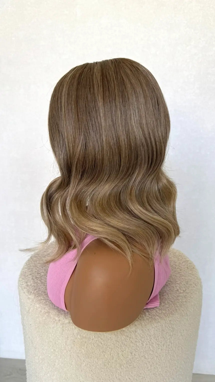 dune- side on view showing the sandy blonde natural colour- synthetic wig.