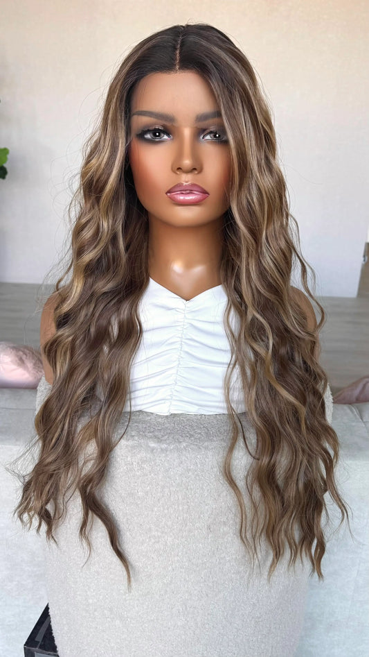 dark root to brunette with highlights wig. front of view, middle part, wavy hair.