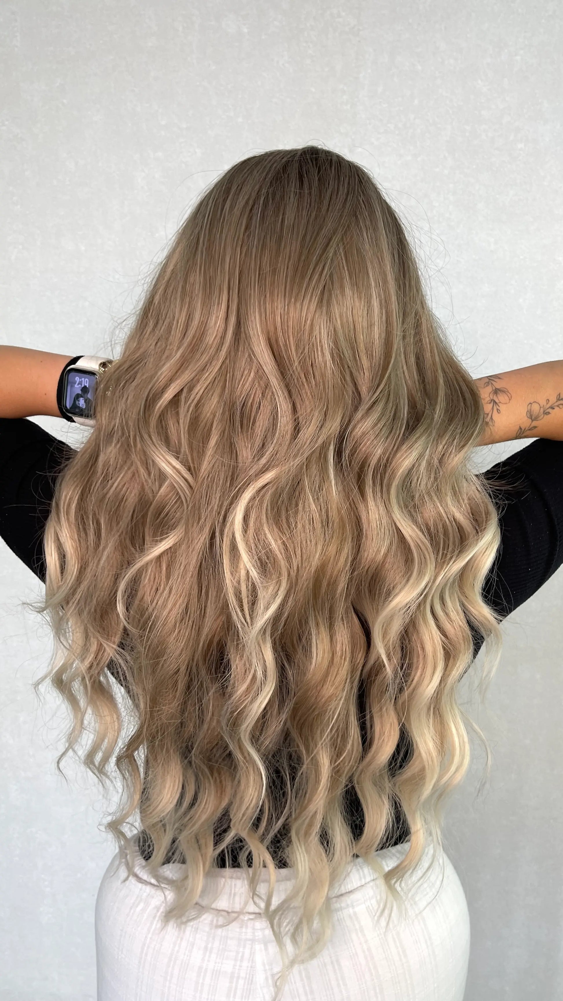 syntheic wig from the back , natural ash hair colour. balayage