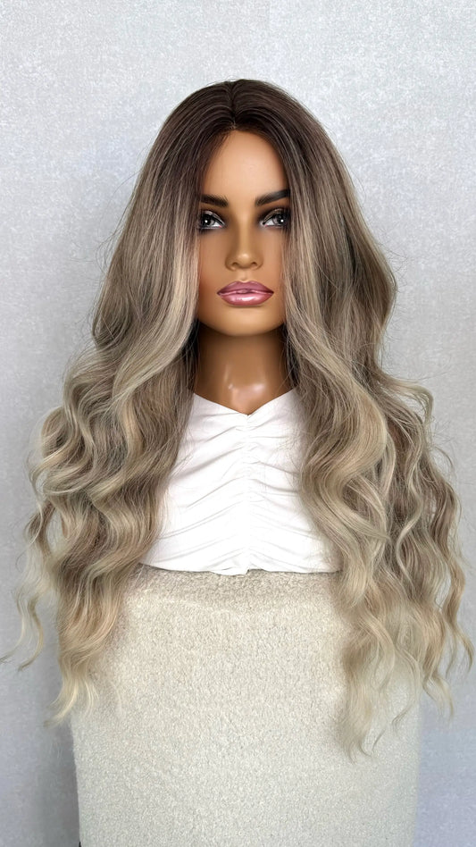 ash blonde synthetic, wavy hair. ombre ash blonde synthetic from front on view. light wavy hair. 