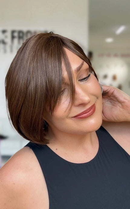 fringe parted to the left hand side, short bob length perfect for everyday wear. chocolate brunette.