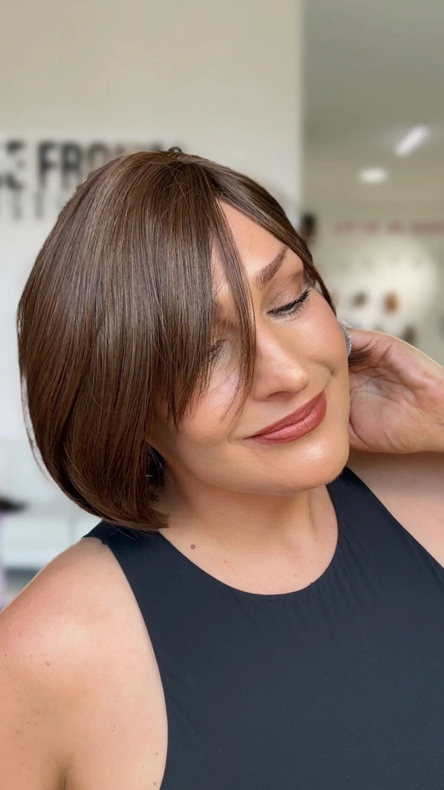 fringe parted to the left hand side, short bob length perfect for everyday wear. chocolate brunette.