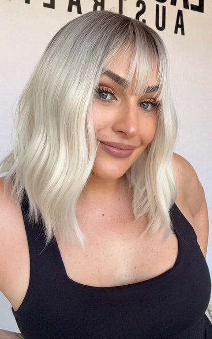 fringe synthetic heat safe, platinum blonde hair with dark root, middle part, glueless wig australia.