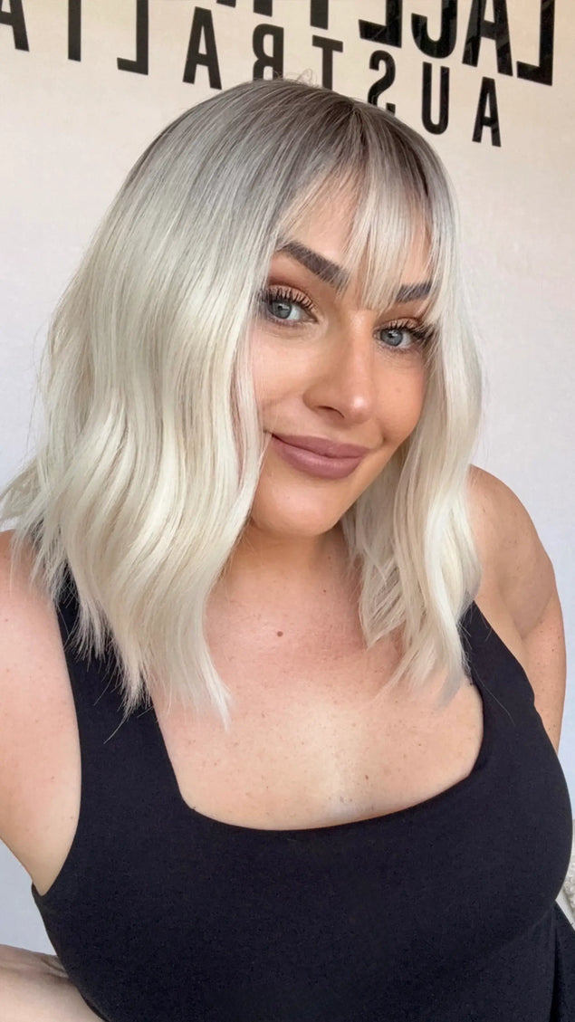 fringe synthetic heat safe, platinum blonde hair with dark root, middle part, glueless wig australia.